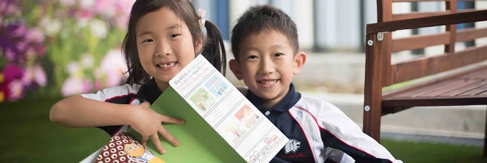 Students reading in Stamford American HK Garden
