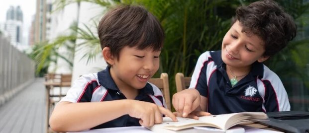 Elementary students reading at Stamford HK