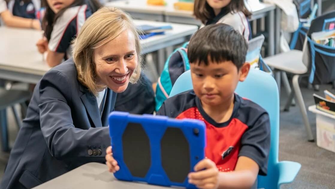 Head of School advising elementary Stamford American School HK student