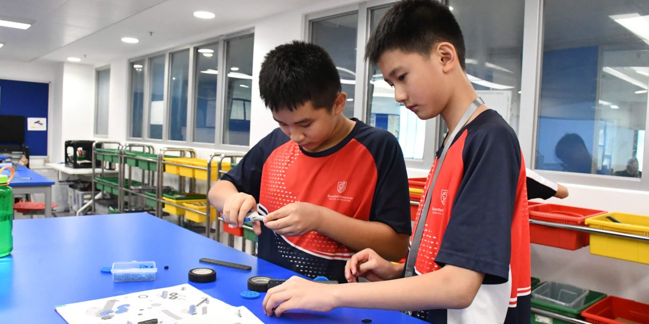 students building a car