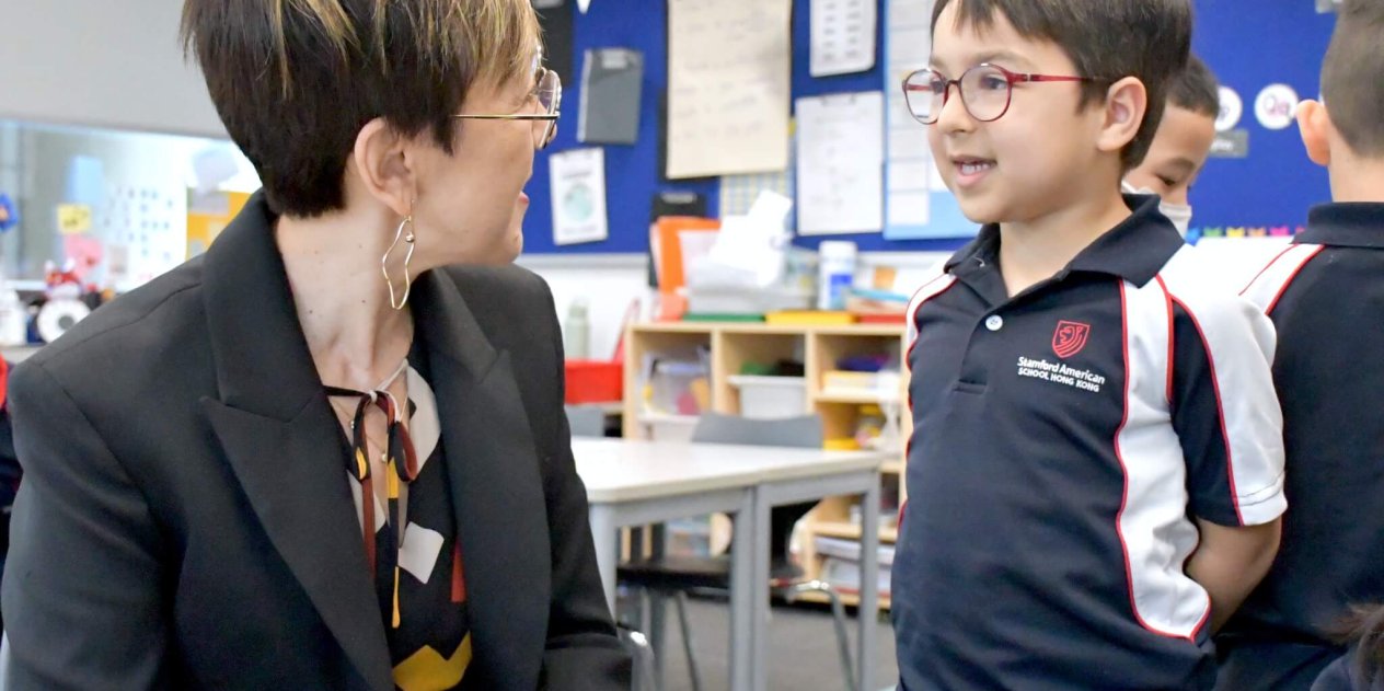 teacher talking to student