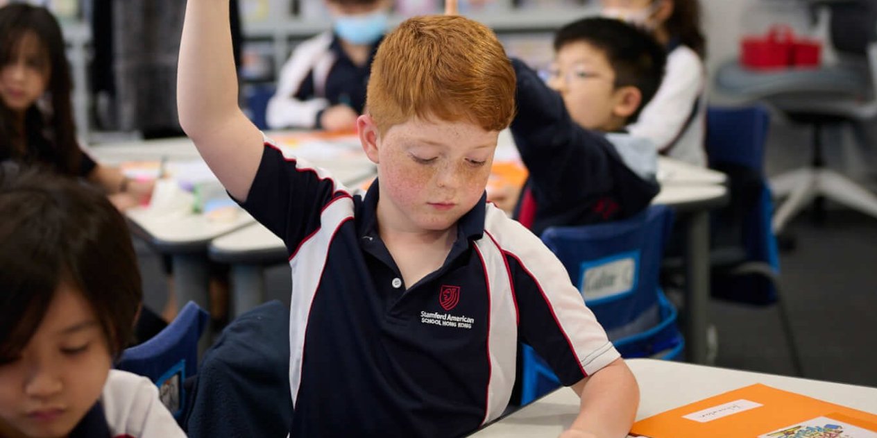 child putting his hand up