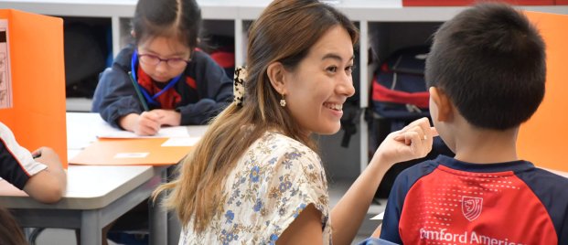 SAS_2963-min teacher helping student with school work