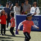 child playing at a sports day