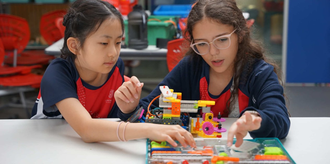two students building a figure