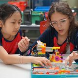 two students building a figure