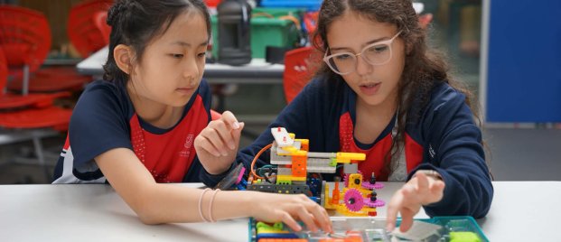 two students building a figure
