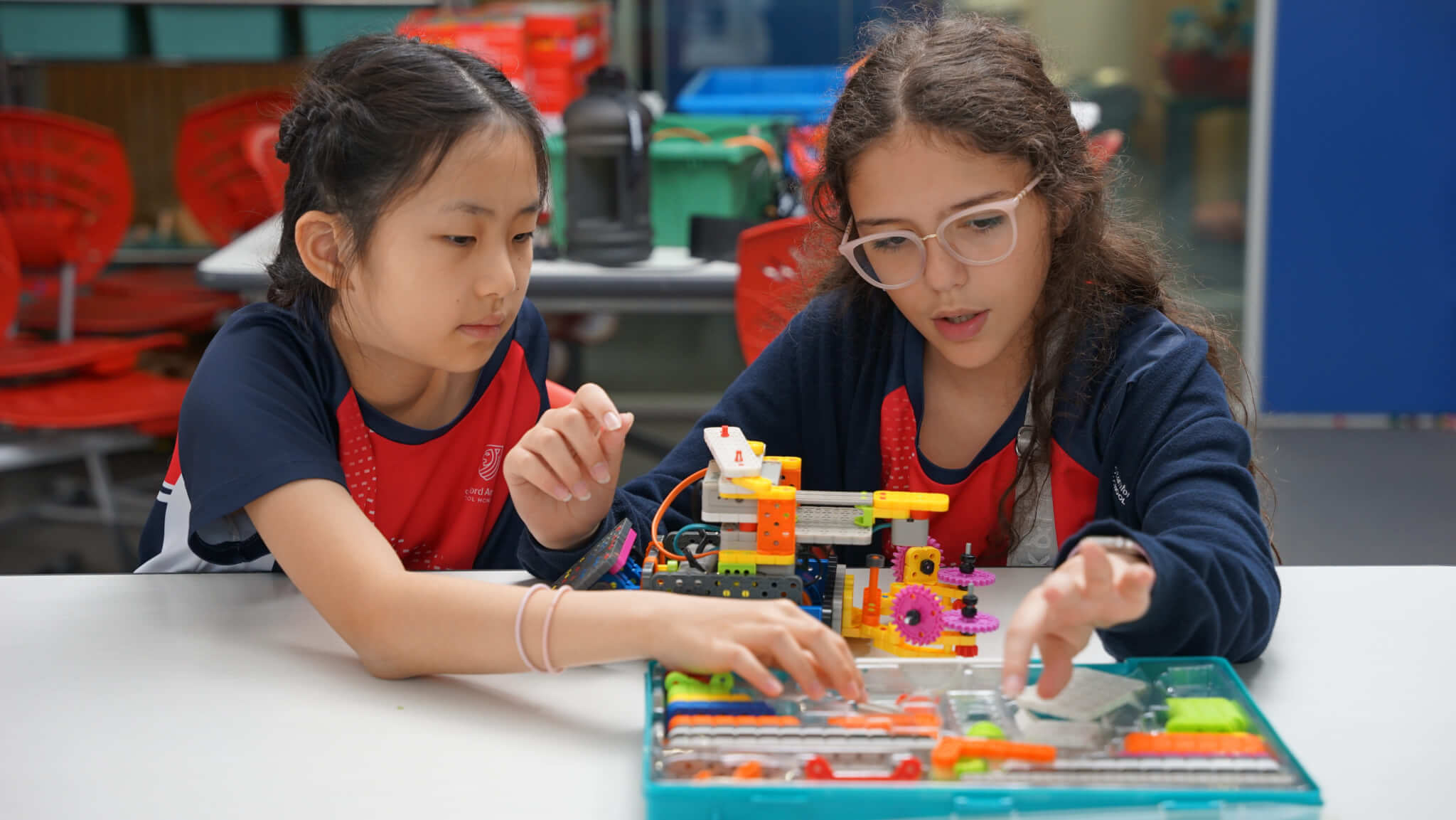 two students building a figure
