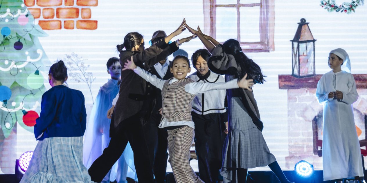 child performing on stage