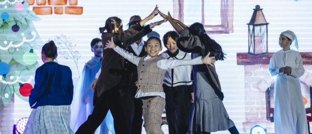 child performing on stage