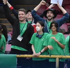 Teachers are cheering for teams in Sports Day