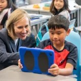 Head of School advising elementary Stamford American School HK student