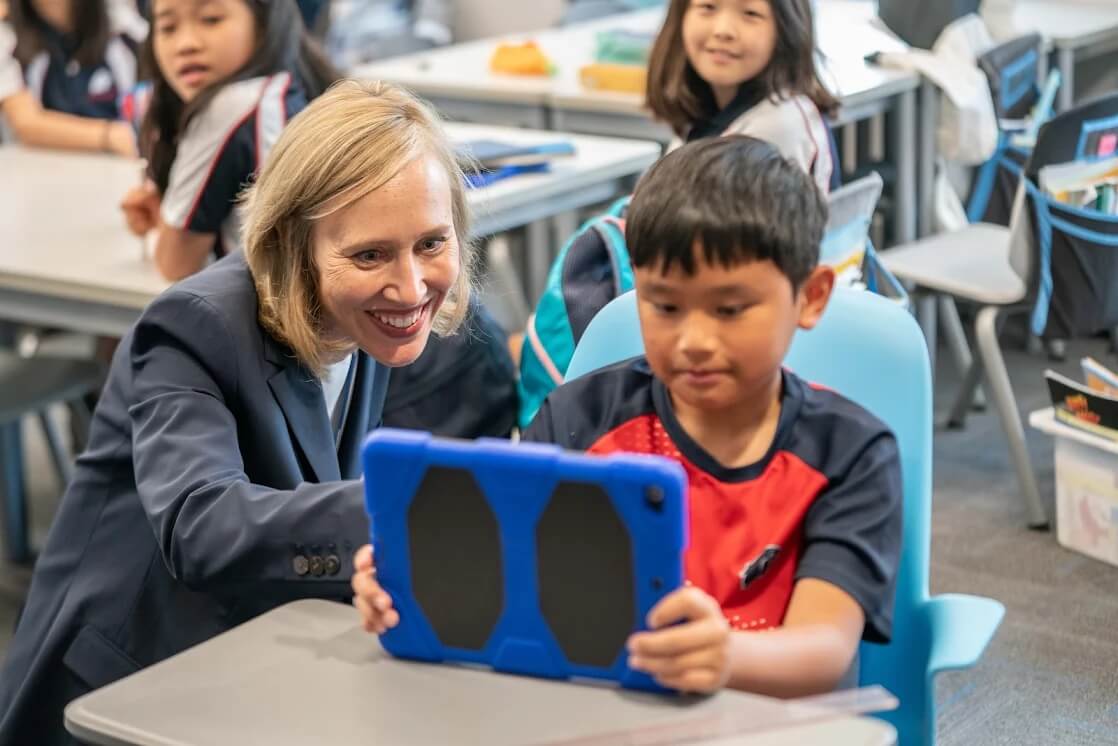 Head of School advising elementary Stamford American School HK student