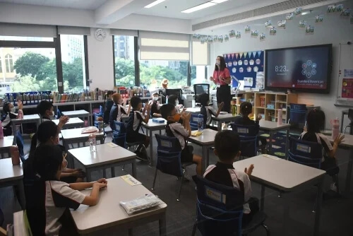 Elementary students listening to MAP test instructions at Stamford HK