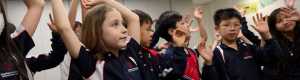 Stamford Elementary students raise their hands