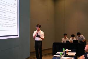 Beny confidently presents their groundbreaking project during the competition.