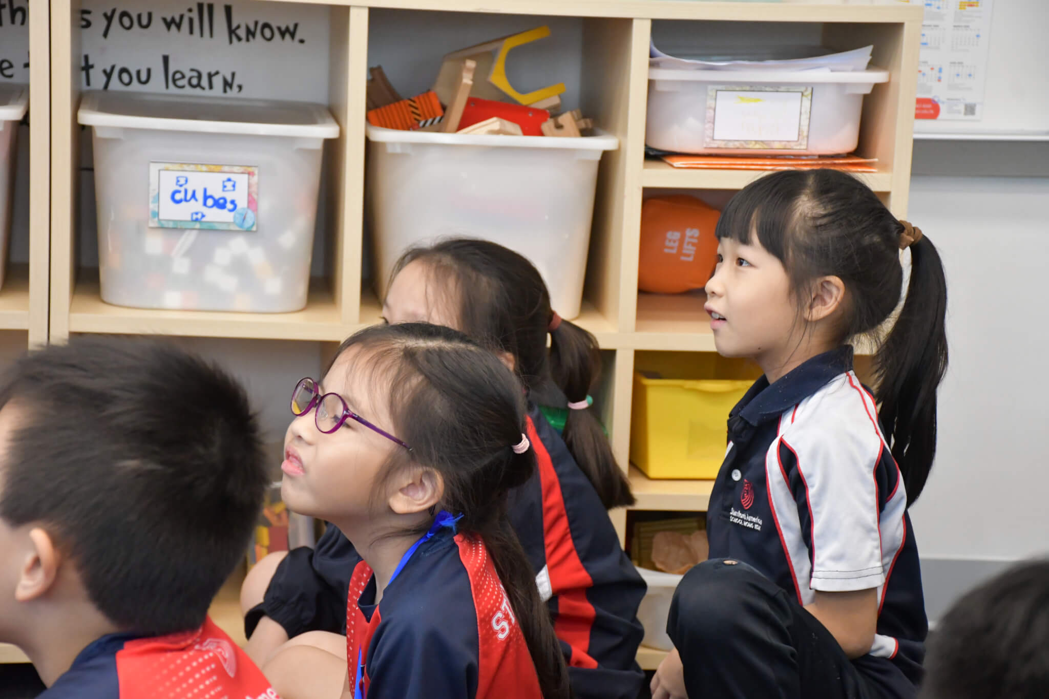 children listening in class